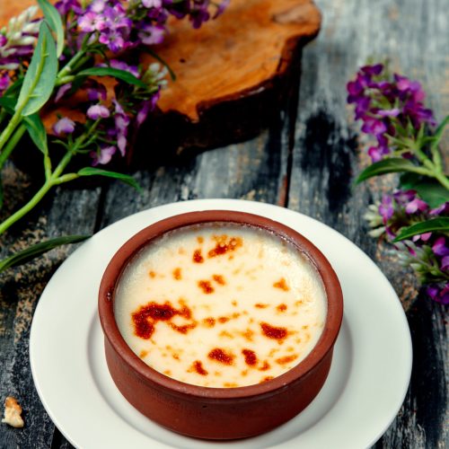 turkish milk pudding sutlach desert in pottery bowl